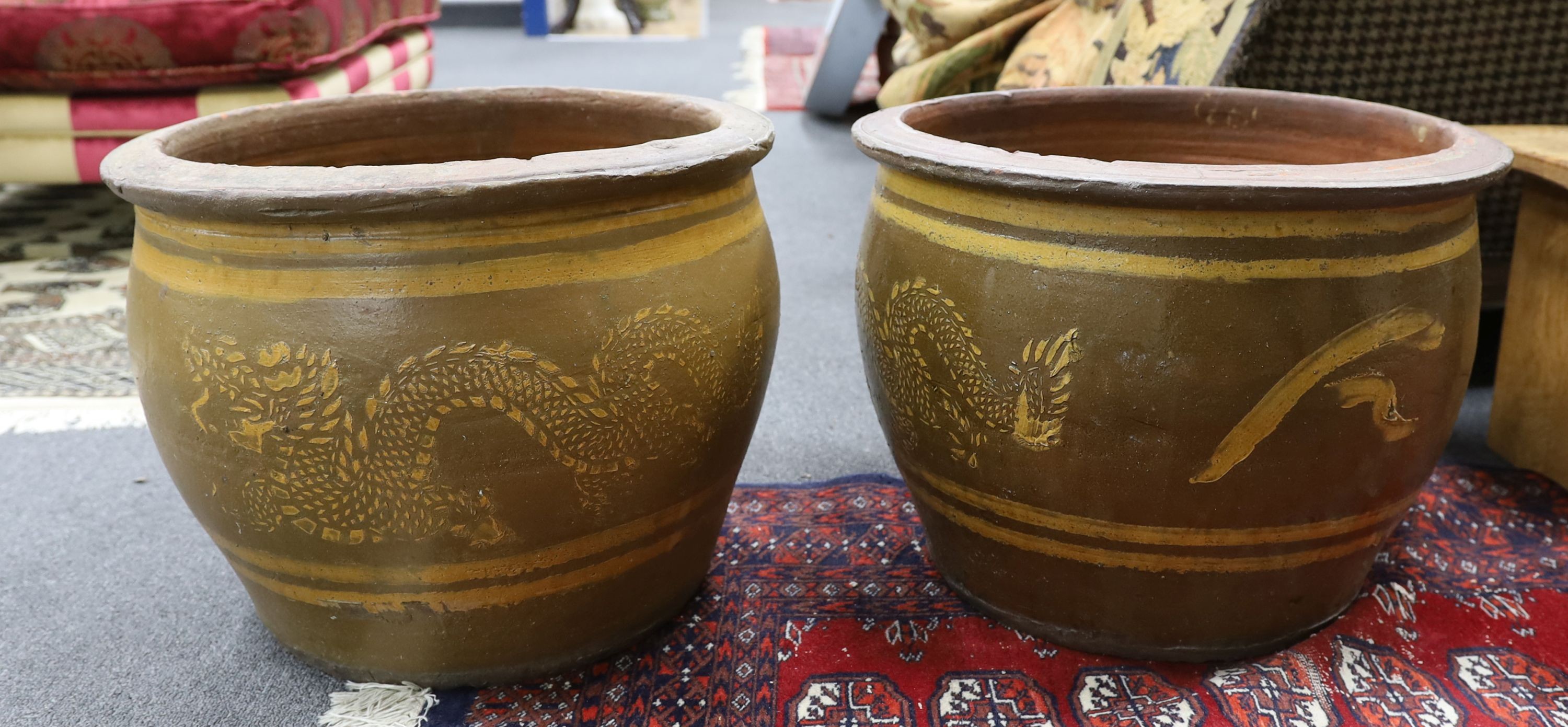 Two Chinese style circular glazed terracotta garden planters, width 49cm, height 38cm